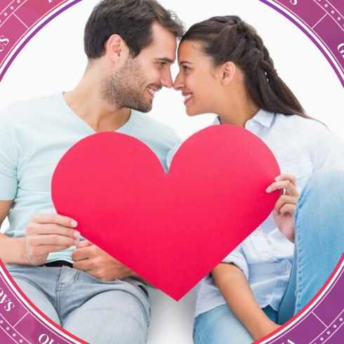 A couple holding a red heart